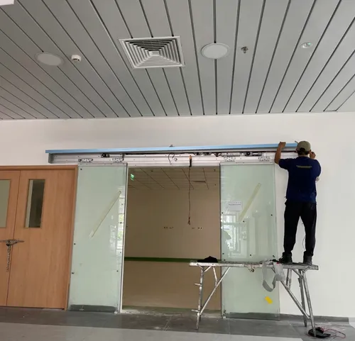 When should you replace an automatic door motor instead of repairing it?