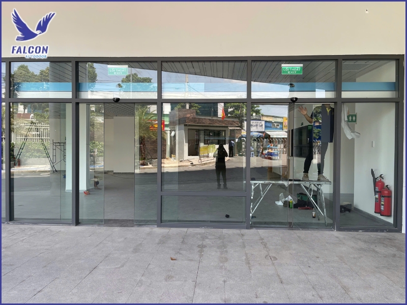 What does the cost of converting a traditional door to an automatic door include?