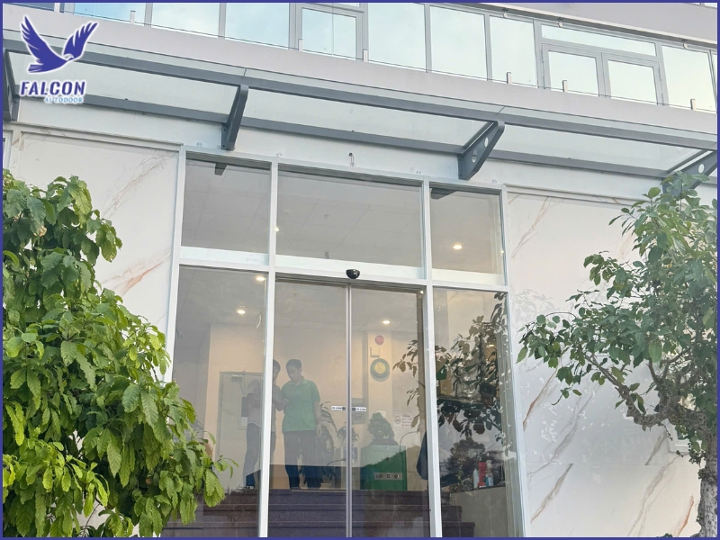 Why do automatic doors affect electricity costs?