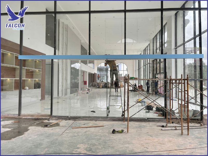 Why do car and motorcycle showrooms need automatic doors?