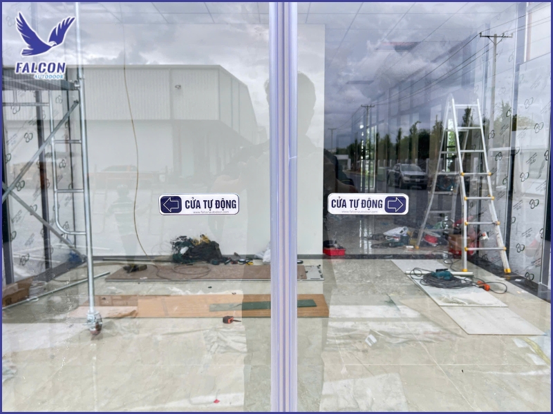 Why should businesses carefully consider before installing automatic doors?